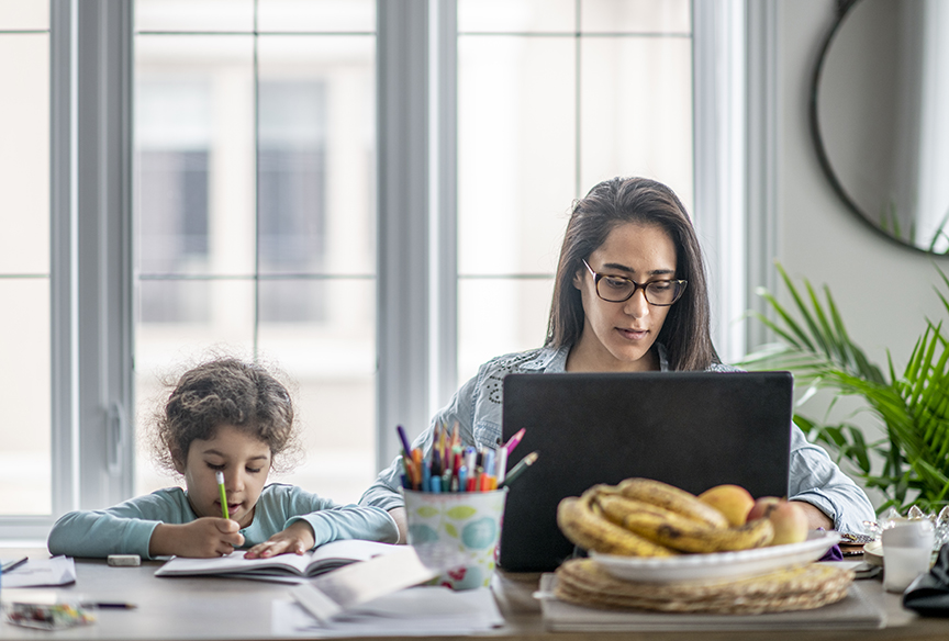 Mom working from home with child