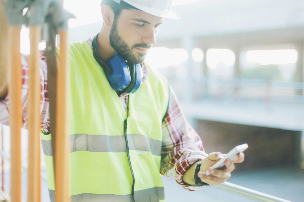 Land surveyor on phone using app