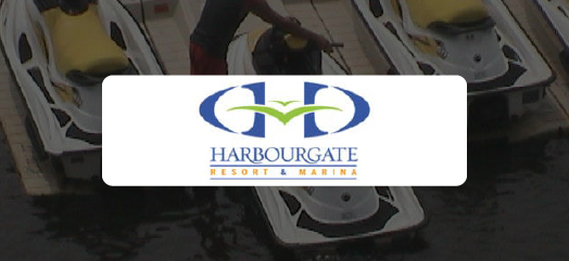 Harbourgate Resort & Marina logo in front of a marina