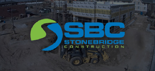 SBC Stonebridge Construction logo in front of a construction site