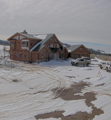 A completed home build or mountain house in the snow captured by a TrueLook Construction Camera
