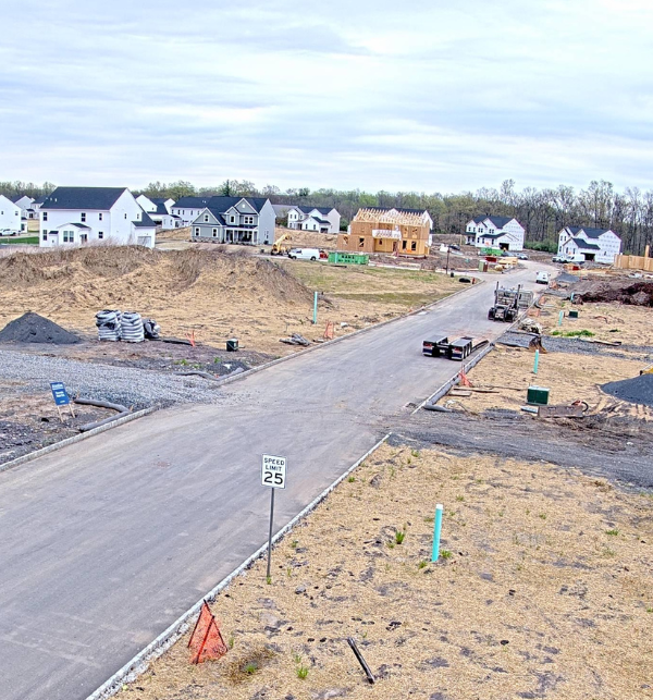 A construction camera photo of a home being framed 