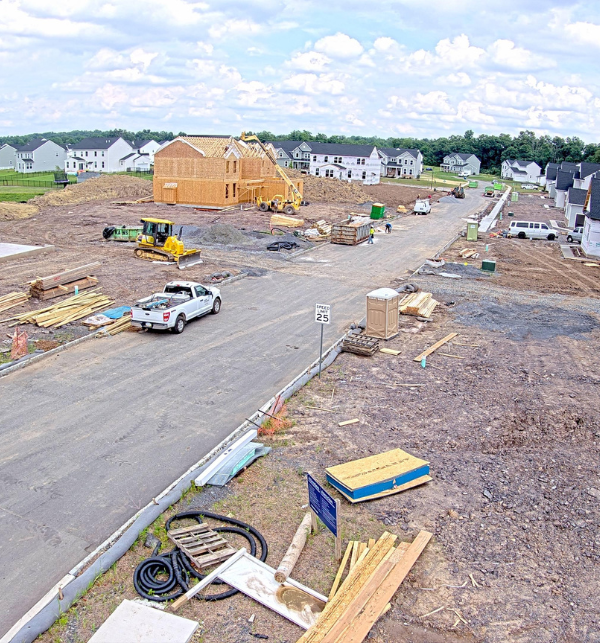 A construction camera photo of a neighborhood of homes being constructed