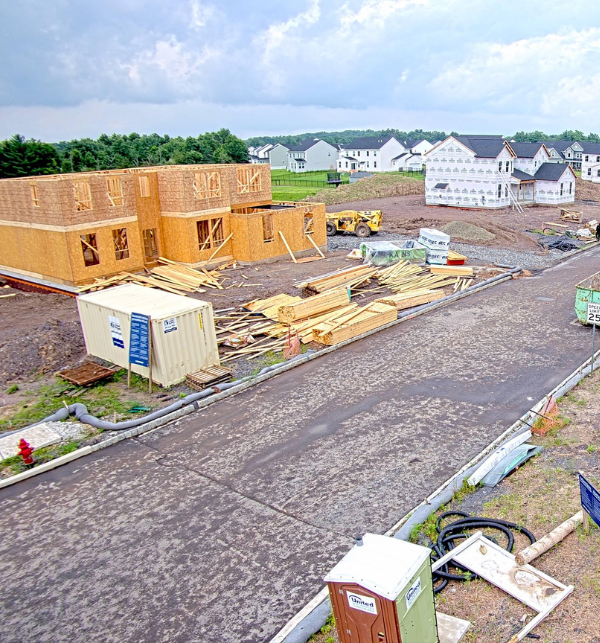A construction camera photo of a two-story home being built
