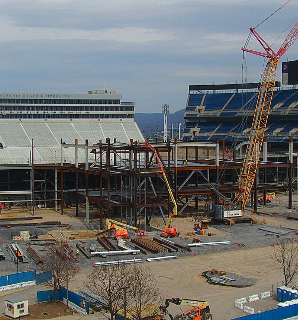 Construction workers and equipment on site of the Penn State Beaver Stadium Renovations rebuilding the new side captured by a TrueLook Camera