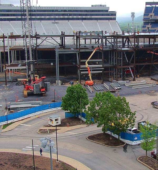 Construction workers and equipment on site of the Penn State Beaver Stadium Renovations working on construction of the west side captured by a TrueLook Camera