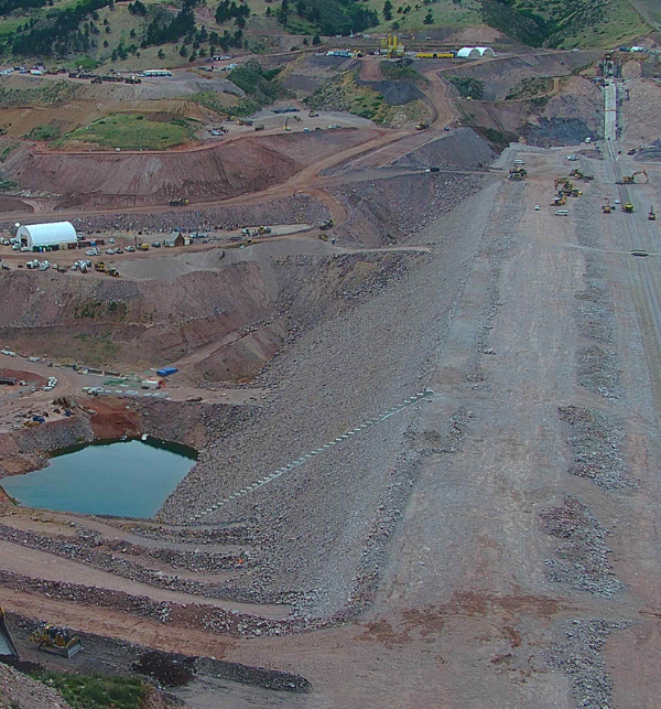 Barnard Construction team working on Chimney Hollow Reservoir in 2024. There are multiple pieces of equipment and a tent up. Image is captured by construction camera.