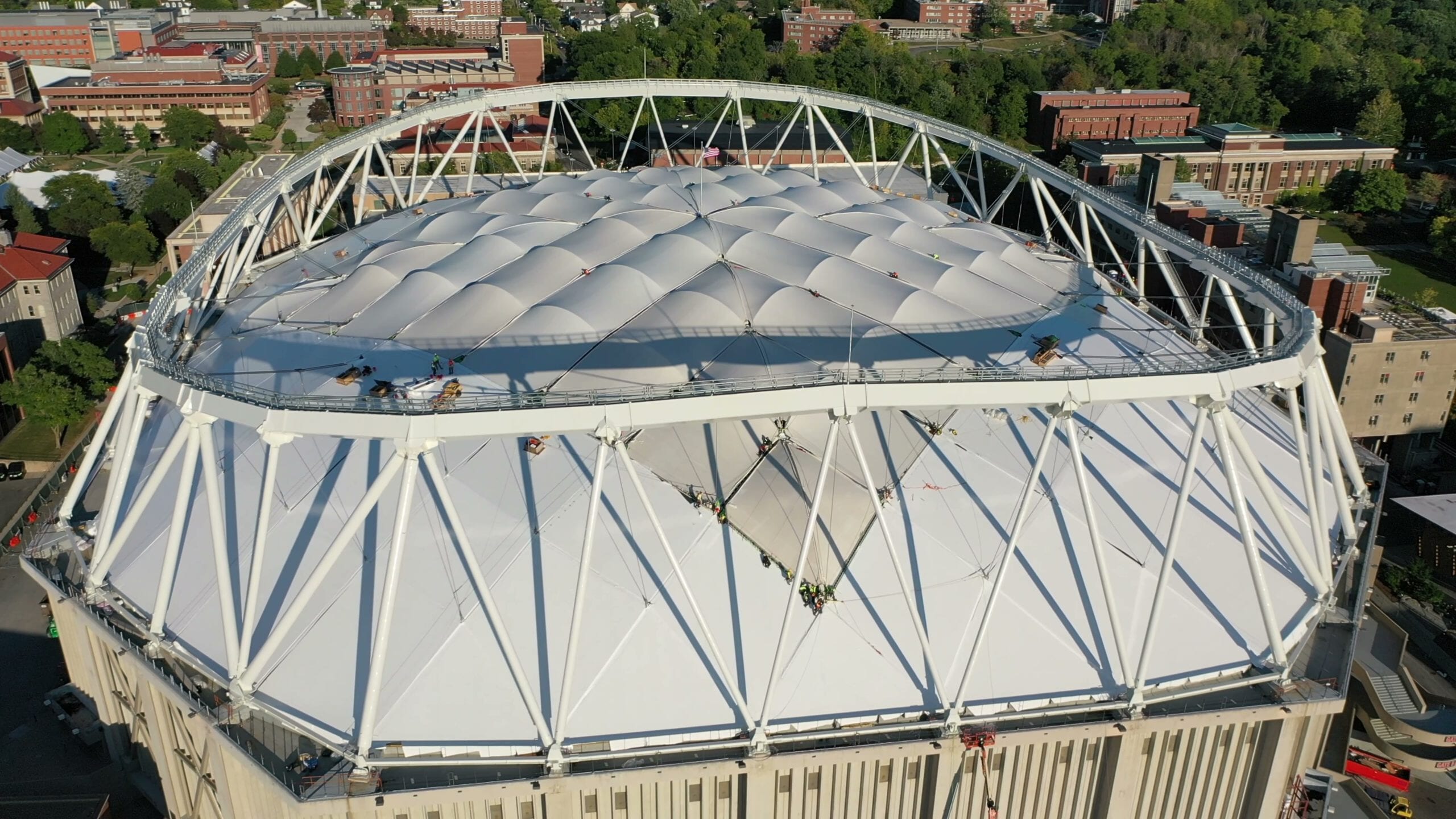 Aerial view of a domed stadium roof under renovation