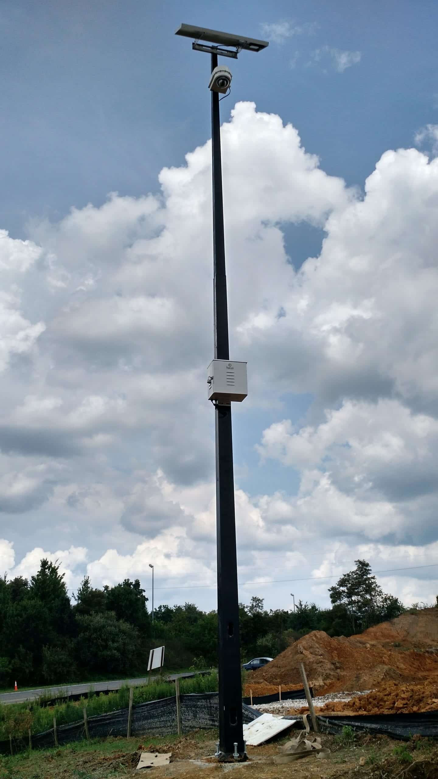 Camera mounted on a tall pole at a jobsite
