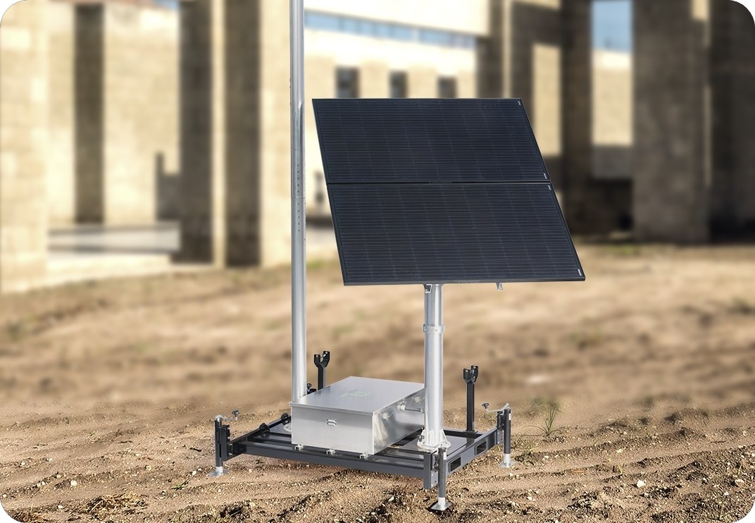Redesigned TrueLook solar skid with a solar panel, mast, and equipment box on a jobsite