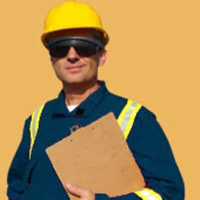 Worker in a hard hat holding a clipboard