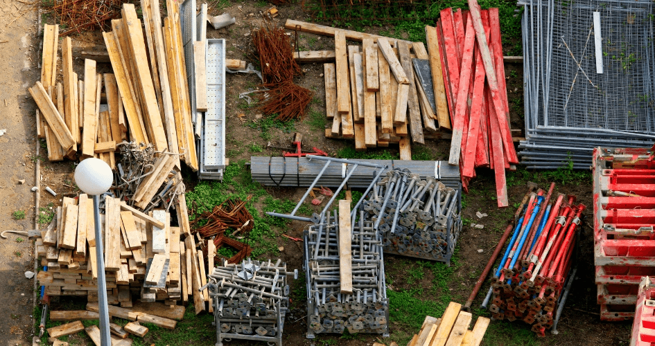 Stacks of lumber and scaffolding materials on a jobsite