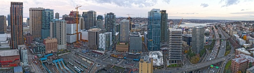 Aerial view of a downtown skyline with cranes