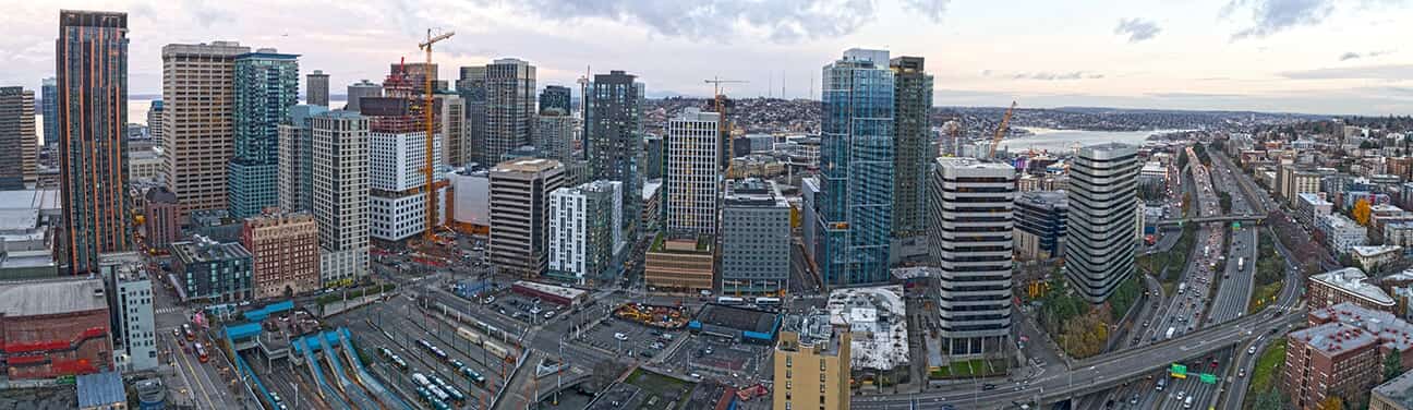 Aerial view of a downtown skyline with cranes