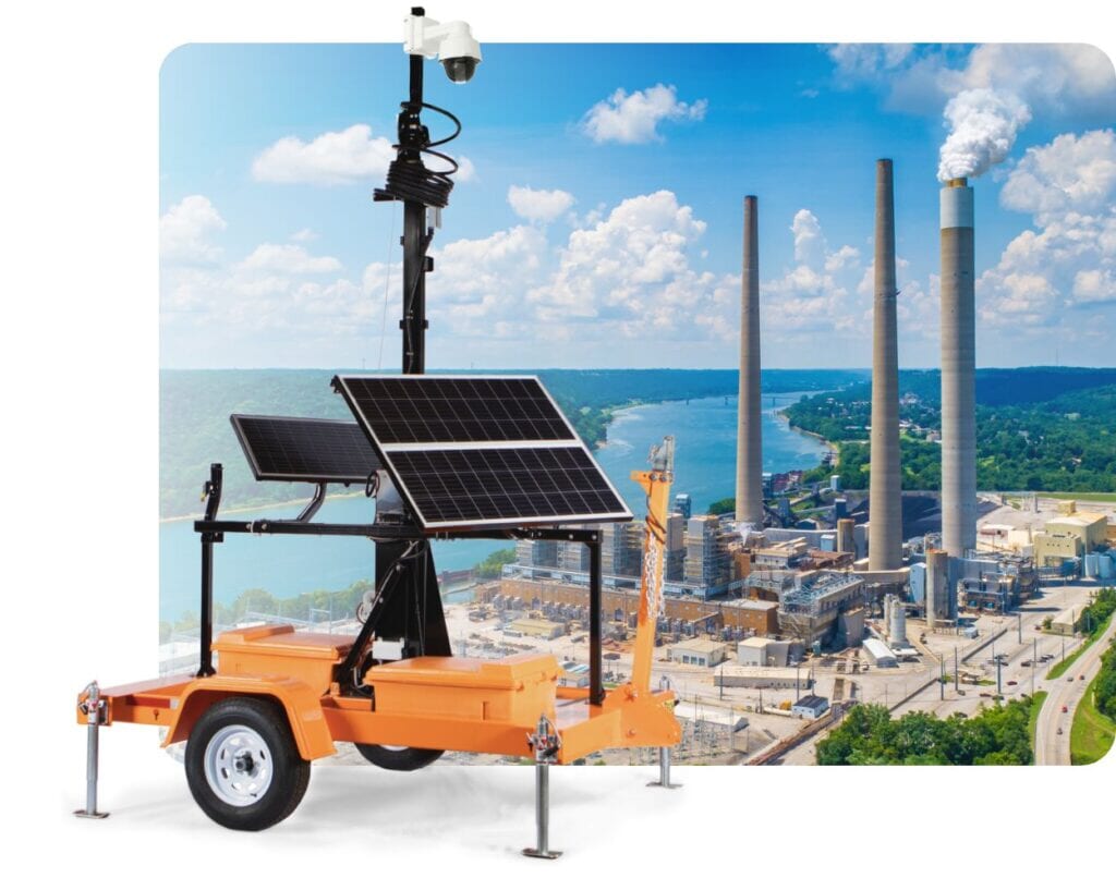 Solar mobile surveillance trailer in front of a power plant