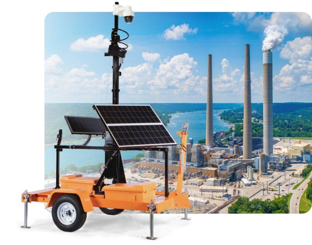 Solar mobile surveillance trailer in front of a power plant