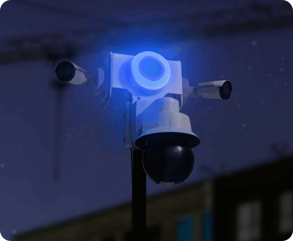 TrueShield security unit glowing with a blue strobe light at night
