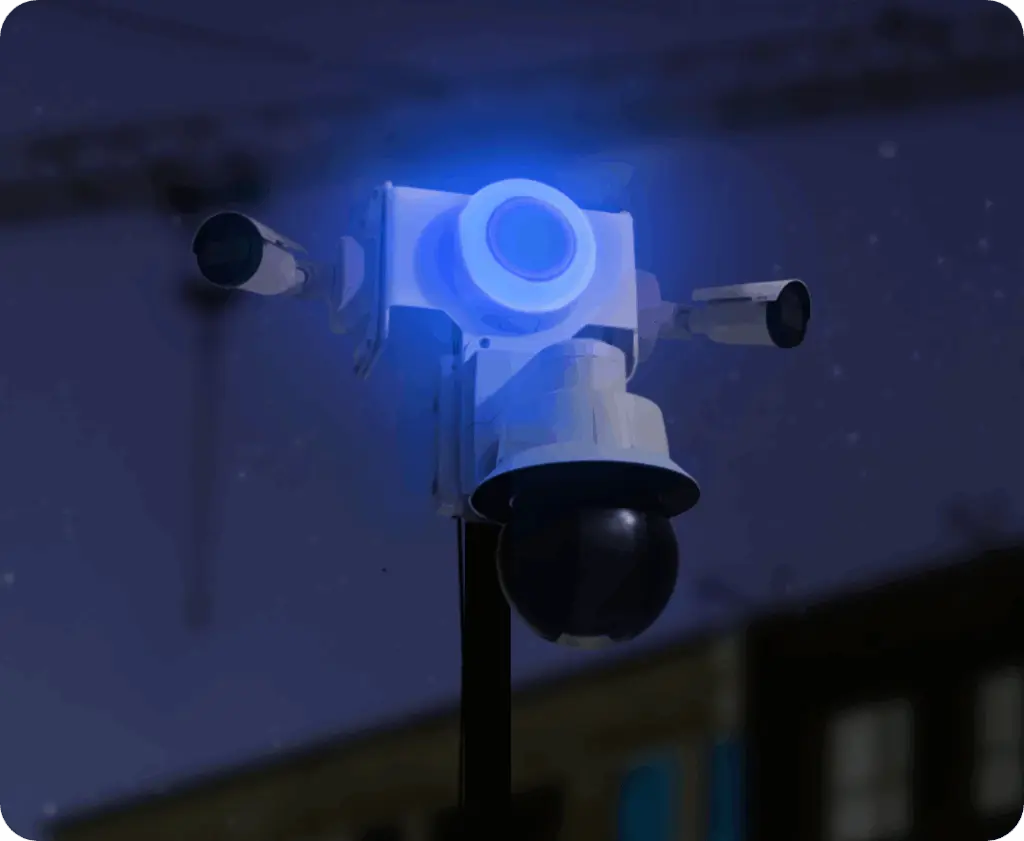 TrueShield security unit glowing with a blue strobe light at night