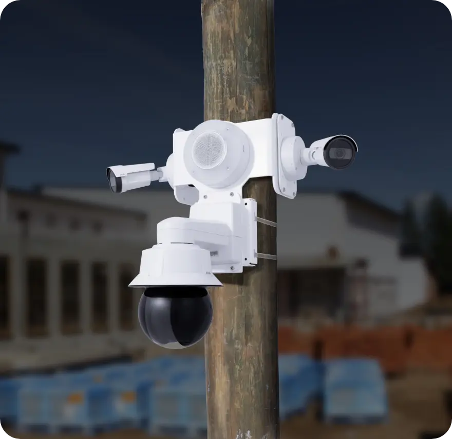 TrueLook TrueShield security unit with multiple cameras mounted on a wooden pole at dusk