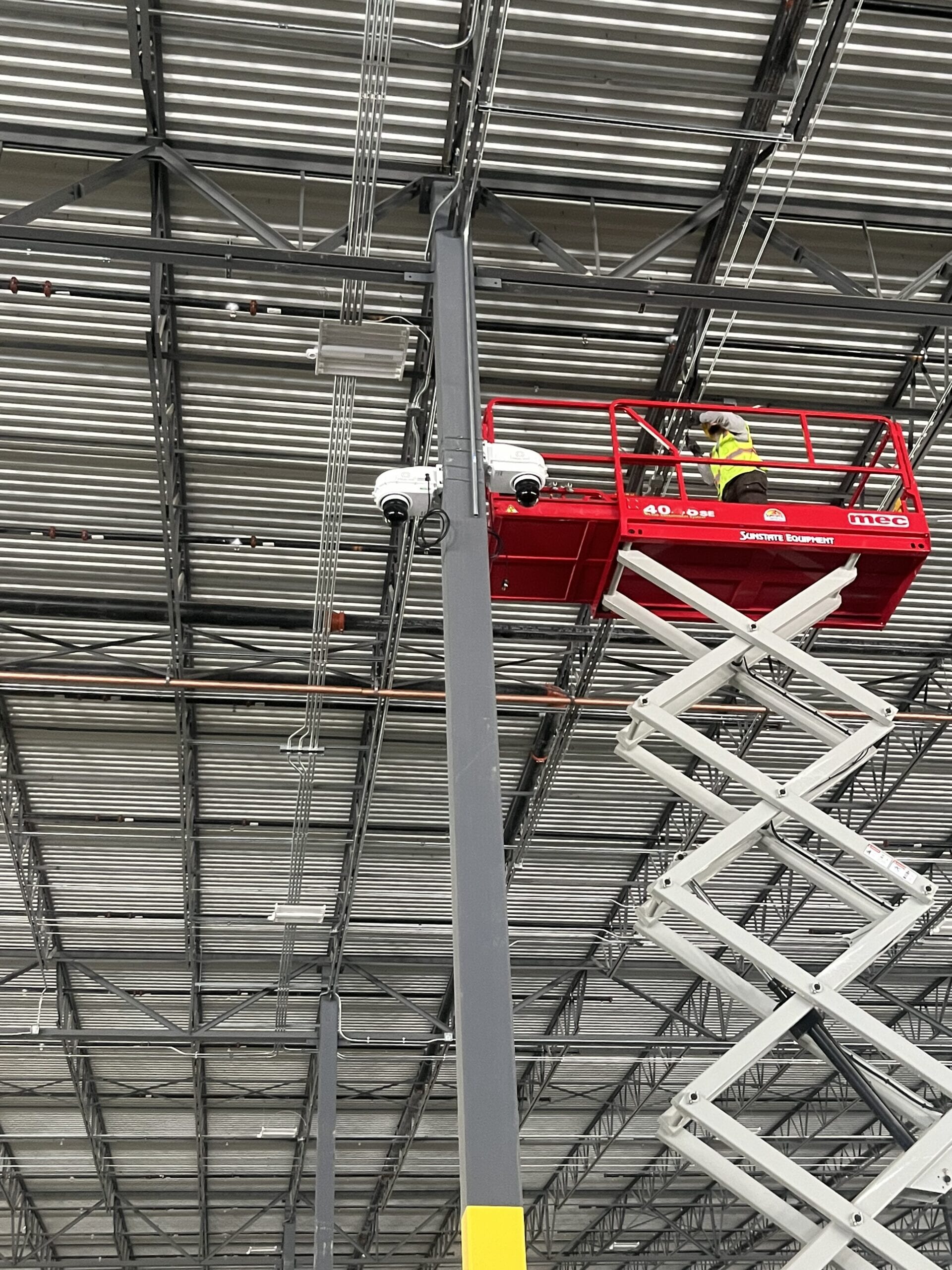 Two PTZ cameras pole mounted inside a project