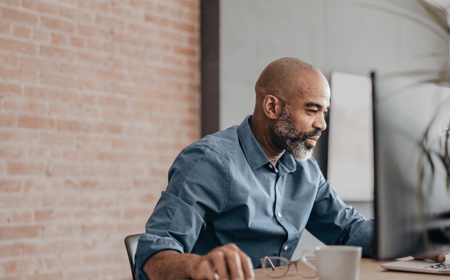 Owner and developer reviewing projects at his desk