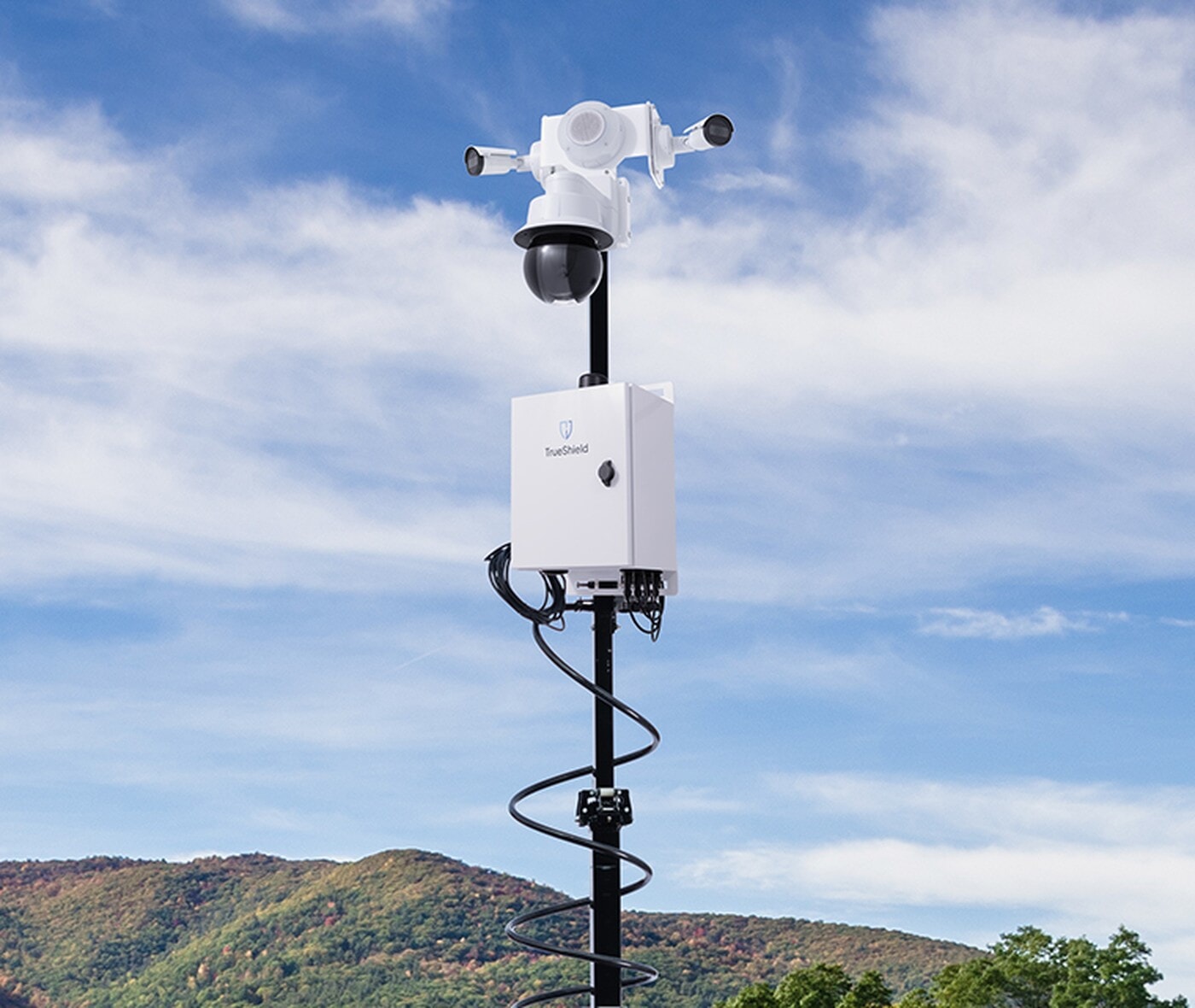 Mobile Surveillance Trailer mast with TrueShield cameras against the sky